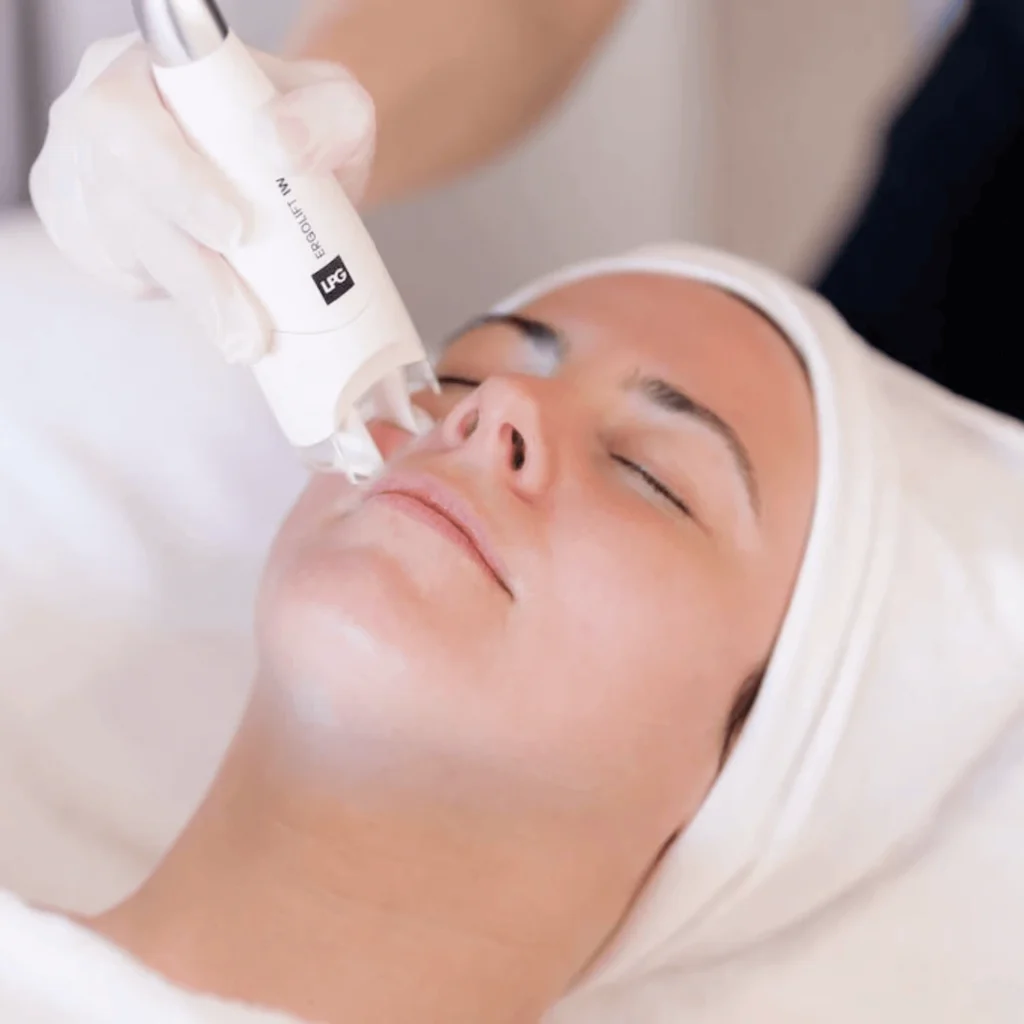 Close-up of a woman receiving Endermologie® facial treatment with handheld device — ideal for targeted Endermologie® marketing content.