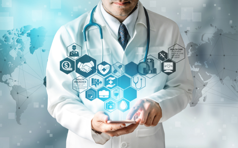 Doctor in clinic reviewing patient chart with digital marketing icons in background